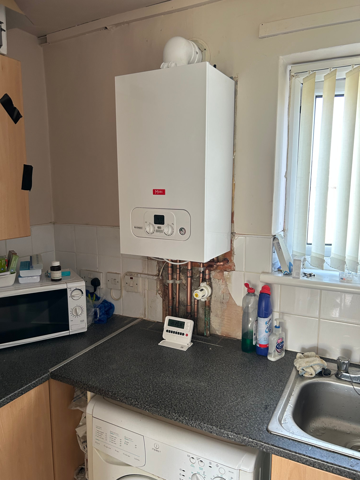 Combi boiler fitted above a kitchen worktop in a Liverpool home