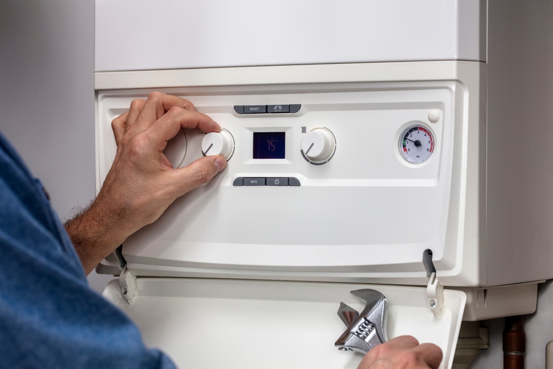 Engineer diagnosing a boiler fault during an emergency repair in Liverpool